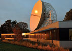 The SKA Organisation headquarters at Jodrell Bank Observatory near Manchester, UK, and the Lovell Telescope in the background.